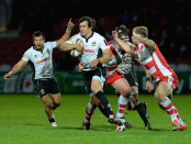 GLOUCESTER, ENGLAND - DECEMBER 07:  Matt Kvesic of Gloucester Rugby tackles Matteo Pratichetti of Zebre during the European Rugby Challenge Cup match between Gloucester Rugby and Zebre at Kingsholm Stadium on December 7, 2014 in Gloucester, England.  (Photo by Tony Marshall/Getty Images)